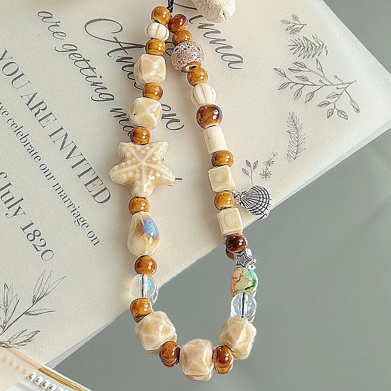 Чехол для телефона из ракушки морской звезды ручной работы, шнурок и браслет на запястье с милой цепочкой для камеры для женщин
Чехол для телефона из ракушки морской звезды ручной работы, шнурок и браслет на запястье с милой цепочкой для камеры для женщин