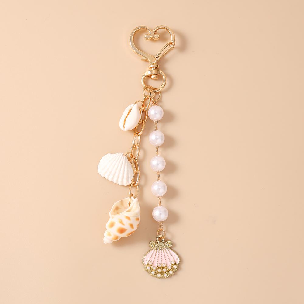Fashion Summer Beach Shell Conch Keychain Pearl Beaded Key Ring Pendant for Women Girls Handbag Decor DIY Handmade Jewelry Gift
Fashion Summer Beach Shell Conch Keychain Pearl Beaded Key Ring Pendant for Women Girls Handbag Decor DIY Handmade Jewelry Gift