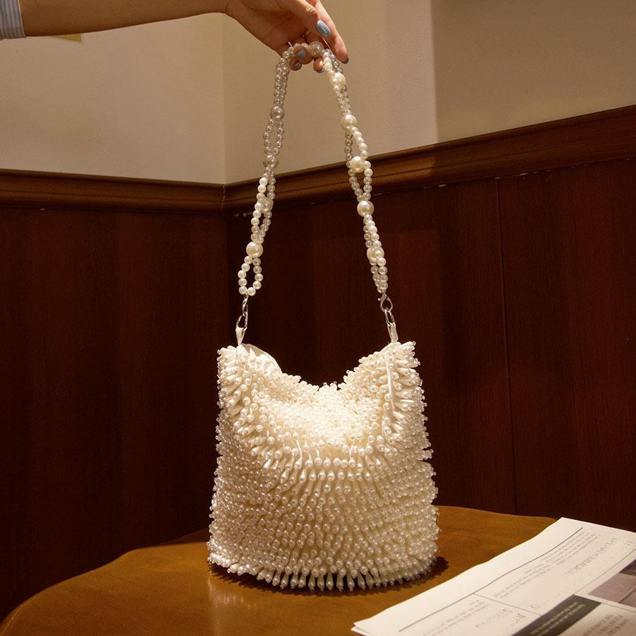 French temperament celebrity beach vacation handwoven bag beaded niche design handbag shoulder bag
French temperament celebrity beach vacation handwoven bag beaded niche design handbag shoulder bag
