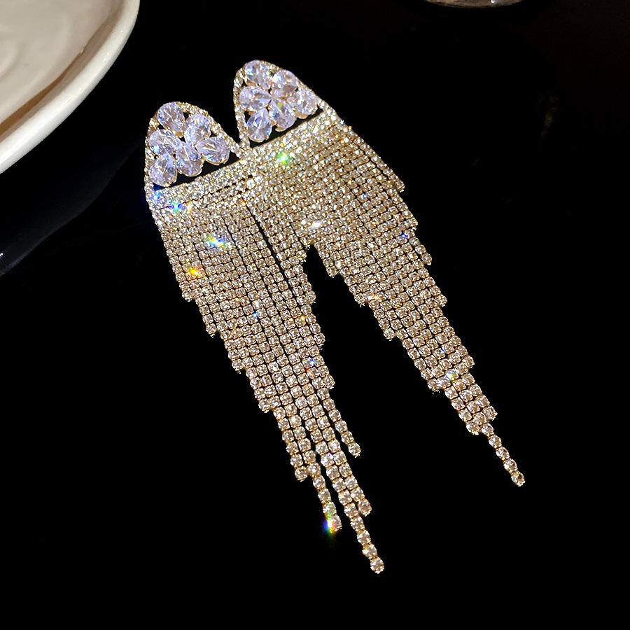 Exaggerated silver needle zircon jellyfish fringed earrings simple and fashionable exquisite earrings light luxury high-end earrings
Exaggerated silver needle zircon jellyfish fringed earrings simple and fashionable exquisite earrings light luxury high-end earrings