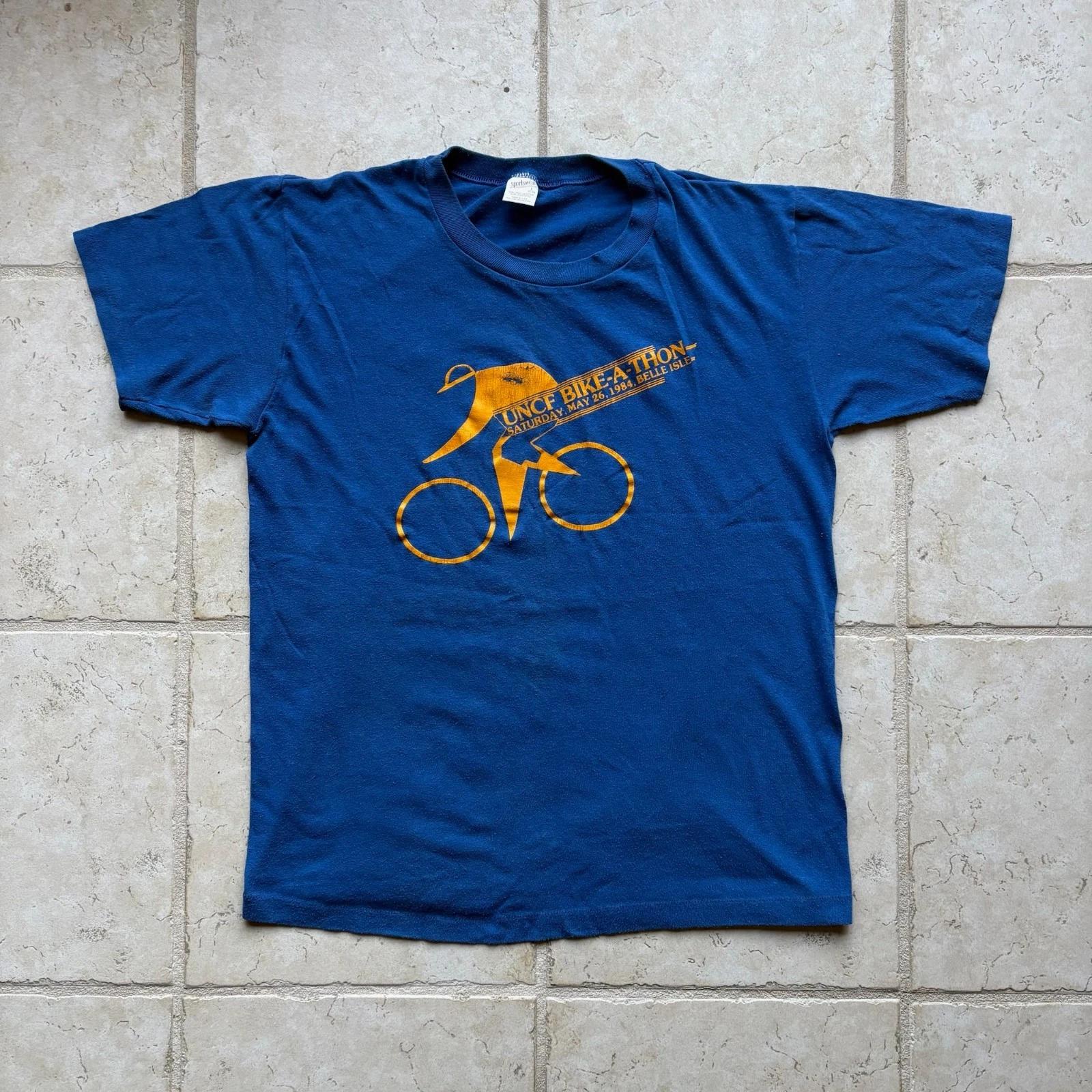 Vintage 1984 JCSU UNCF Bike-A-Thon Tee Blue Single Stitch Made in USA Size Large S
Vintage 1984 JCSU UNCF Bike-A-Thon Tee Blue Single Stitch Made in USA Size Large S