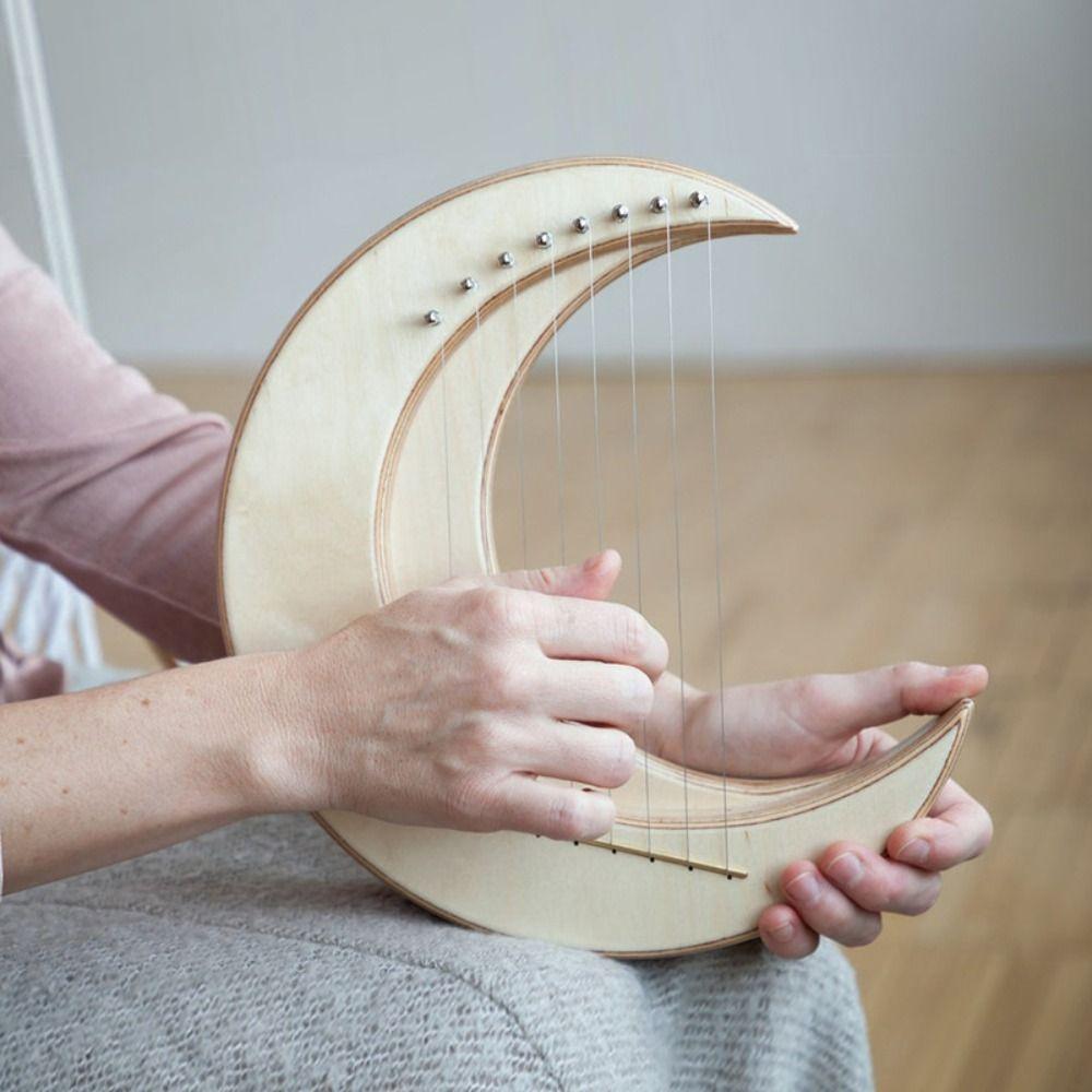 Wooden 7 Strings Portable Lyra Mini 7-string Harp Wood Harp Crescent Moon Lyre Outdoor Games бежевий
Wooden 7 Strings Portable Lyra Mini 7-string Harp Wood Harp Crescent Moon Lyre Outdoor Games бежевий