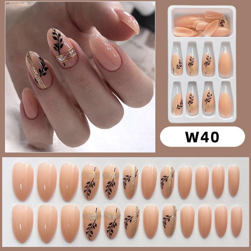 Черно-золотые миндалевидные накладные ногти с блестками и съемным дизайном в виде листьев
Черно-золотые миндалевидные накладные ногти с блестками и съемным дизайном в виде листьев