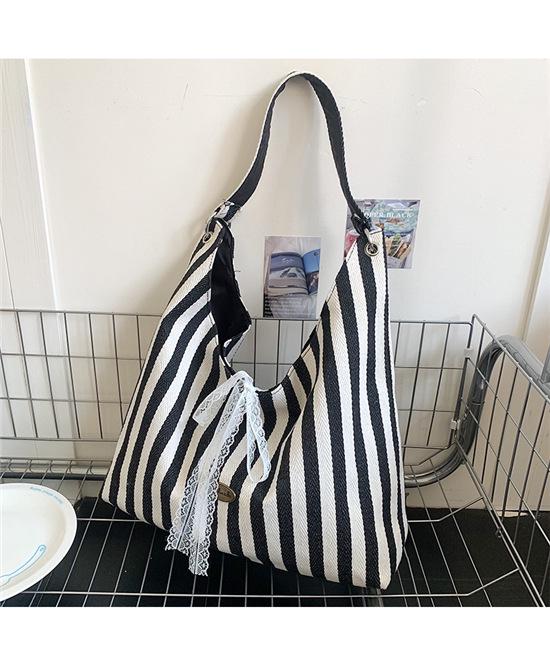 Striped Canvas Commuter Tote: Double-Sided Single Shoulder Bag, Large Capacity, Embroidered, for Women - Perfect for Spring and Summer.
Striped Canvas Commuter Tote: Double-Sided Single Shoulder Bag, Large Capacity, Embroidered, for Women - Perfect for Spring and Summer.