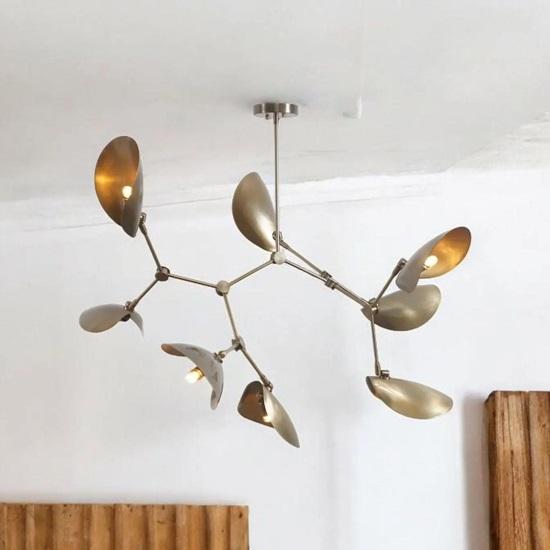 A modern mid-century stilnovo style chandelier with 8-arm, curved disc shades made from rough-hewn slate
A modern mid-century stilnovo style chandelier with 8-arm, curved disc shades made from rough-hewn slate