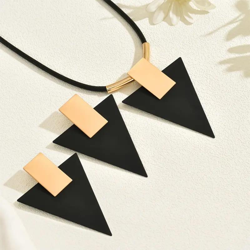 Three-piece women s jewelry set, geometric rectangular inverted triangle two-color splicing pendant with black rope item.
Three-piece women s jewelry set, geometric rectangular inverted triangle two-color splicing pendant with black rope item.