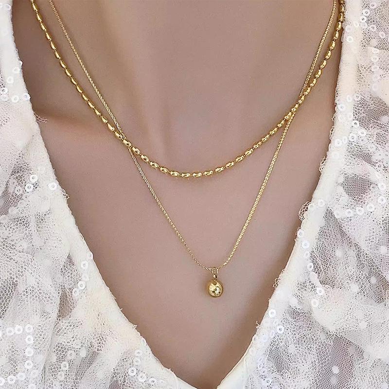 Minimalist Double Layer Gold Bead Titanium Steel Necklace - Stackable, Retro, Exquisite Women s Chain
Minimalist Double Layer Gold Bead Titanium Steel Necklace - Stackable, Retro, Exquisite Women s Chain