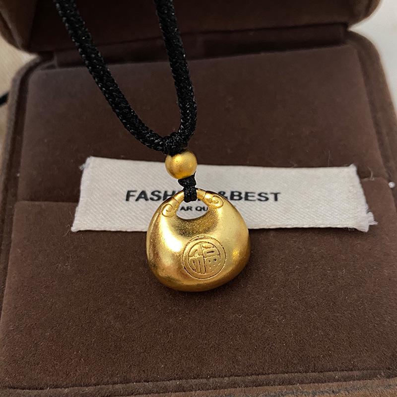 Chinese Style Gold Ingot Pendant with Fu Character Necklace - Elegant Autumn/Winter Accessory on Black Rope Sweater Chain
Chinese Style Gold Ingot Pendant with Fu Character Necklace - Elegant Autumn/Winter Accessory on Black Rope Sweater Chain