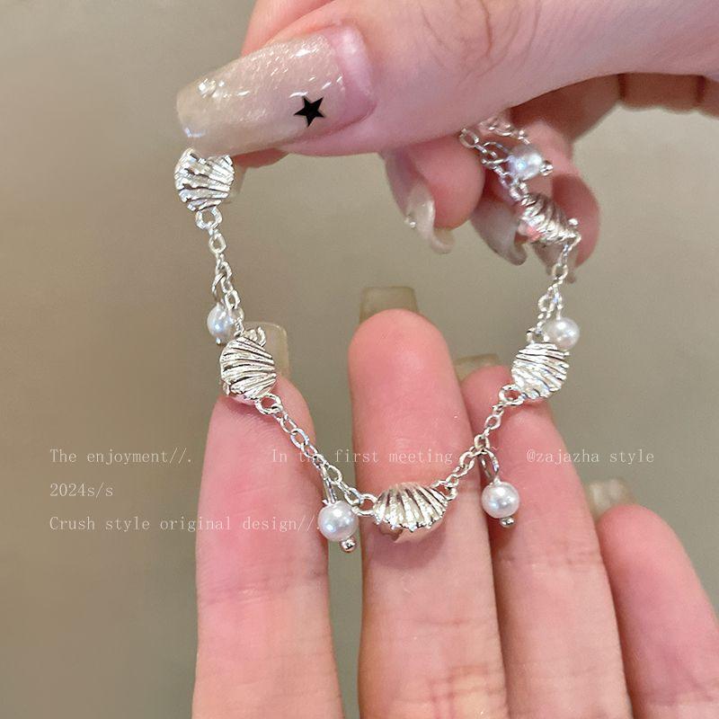 Доступная роскошь Приморский женский нишевый стиль Классический холодный стиль Жемчуг Summer Shell Pearl Chain
Доступная роскошь Приморский женский нишевый стиль Классический холодный стиль Жемчуг Summer Shell Pearl Chain