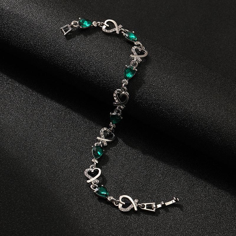 Sterling Silver Bracelet with Teardrop Shaped Gemstones and Heart-Shaped Links Featuring Clear Accent Stones Adjustable Length One Size
Sterling Silver Bracelet with Teardrop Shaped Gemstones and Heart-Shaped Links Featuring Clear Accent Stones Adjustable Length One Size