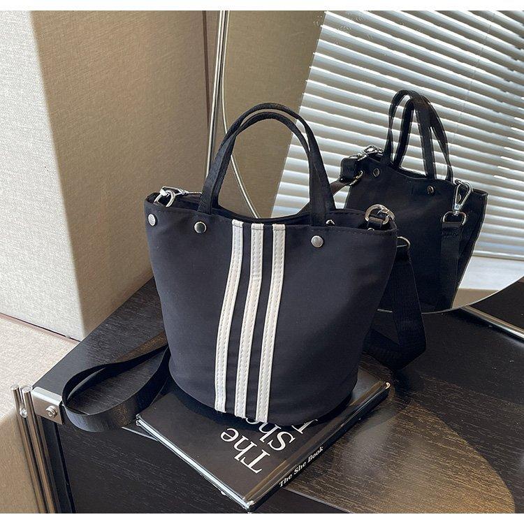 Premium bucket bag women s bag fashion three bars shoulder handbag niche design messenger cloth bag чорний
Premium bucket bag women s bag fashion three bars shoulder handbag niche design messenger cloth bag чорний