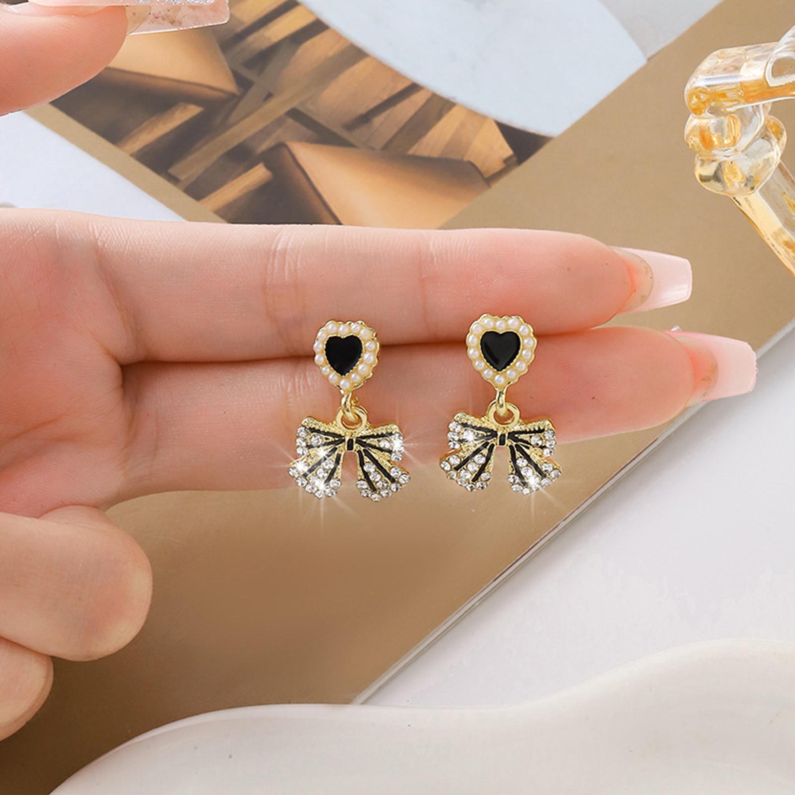 Heart Shaped Stud Earrings with Bow Pendant Dangle Lightweight Metal Alloy Fashion Jewelry for Women and Girls
Heart Shaped Stud Earrings with Bow Pendant Dangle Lightweight Metal Alloy Fashion Jewelry for Women and Girls