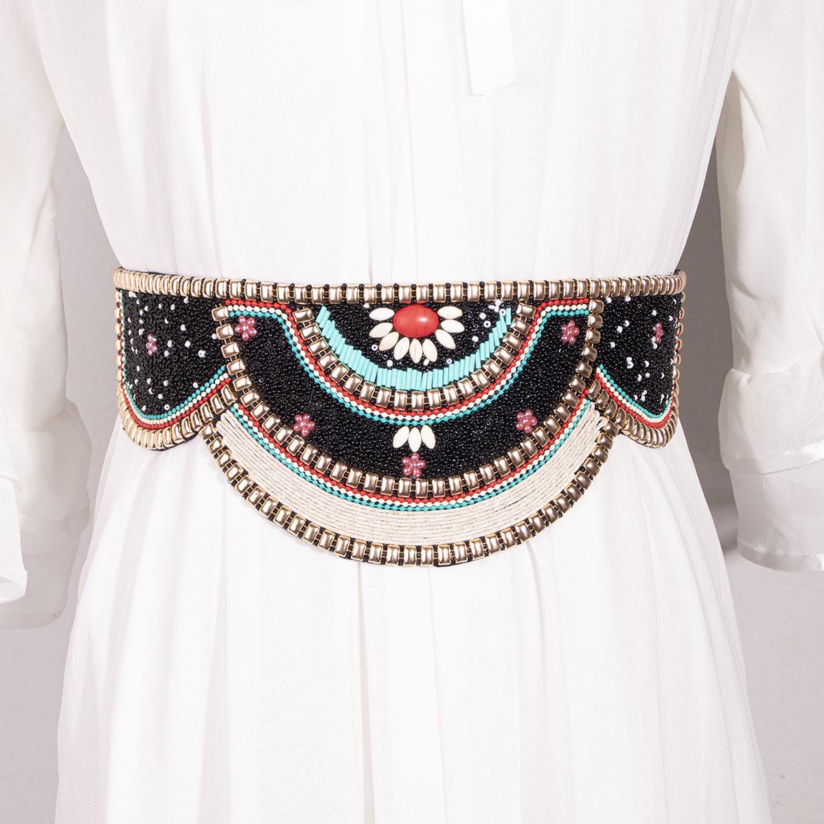 Эластичный пояс ручной работы в стиле бохо с отделкой из бисера и ракушками
Эластичный пояс ручной работы в стиле бохо с отделкой из бисера и ракушками