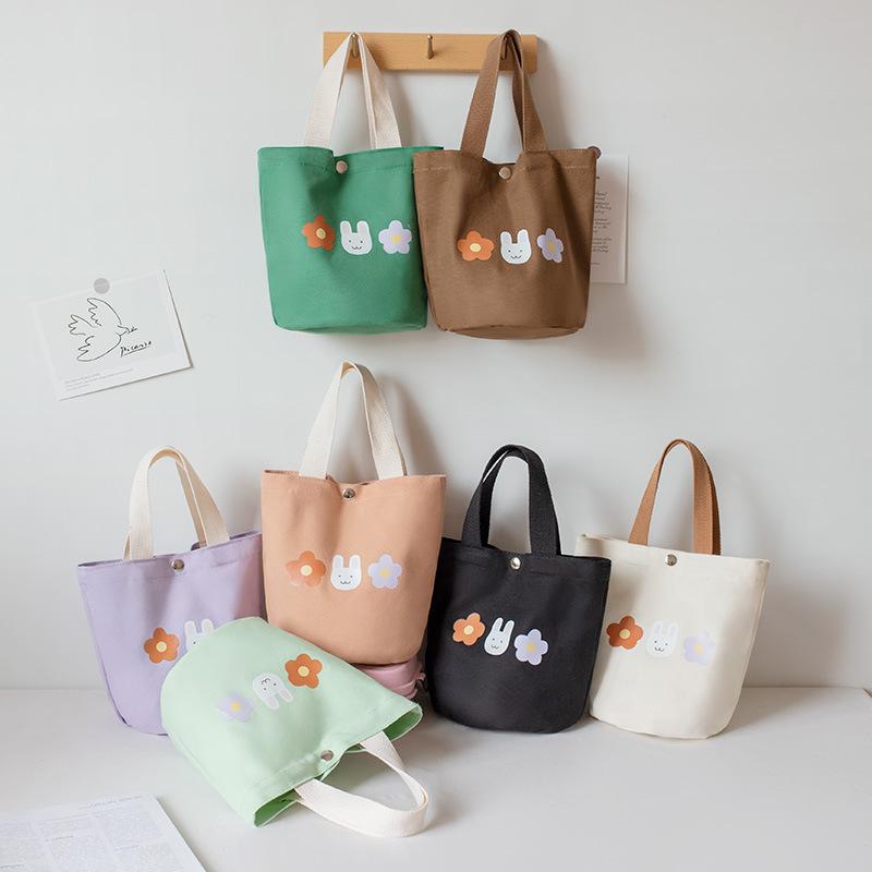 Handbag Women s Canvas Bag New Fashion Student Bring Rice Bag Lunch Box Bento Bag Bucket Hand Carry Small Bag фіолетовий
Handbag Women s Canvas Bag New Fashion Student Bring Rice Bag Lunch Box Bento Bag Bucket Hand Carry Small Bag фіолетовий