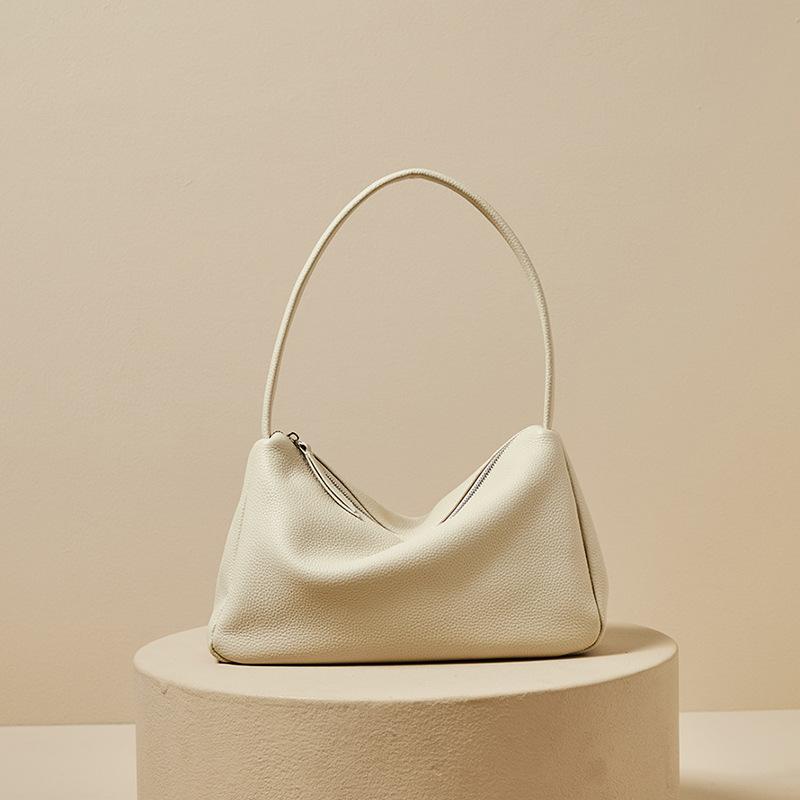 The first layer of togo cowhide shoulder armpit bag, the new high-end textured baguette fashion portable leather women s bag
The first layer of togo cowhide shoulder armpit bag, the new high-end textured baguette fashion portable leather women s bag