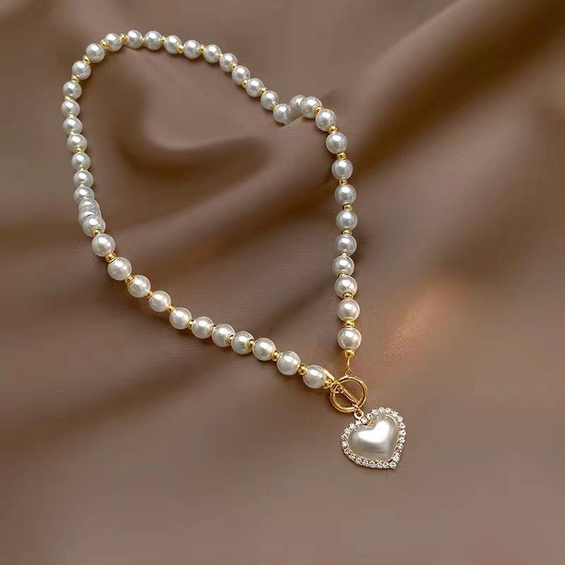 JMXD Любовне Серце Перлове Намисто Жіноче Розкішне Мінімалістичне Y2K Трендове Витончене Чокер Ланцюжок для Светра Мода Елегантні Ювелірні Вироби Подарунок
JMXD Любовне Серце Перлове Намисто Жіноче Розкішне Мінімалістичне Y2K Трендове Витончене Чокер Ланцюжок для Светра Мода Елегантні Ювелірні Вироби Подарунок