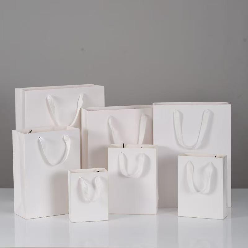 Elegant White Paper Gift Bag for Handbags, Clothing, Glasses, and Cosmetics Vertical 1; 12L*5.7W*16H
Elegant White Paper Gift Bag for Handbags, Clothing, Glasses, and Cosmetics Vertical 1; 12L*5.7W*16H