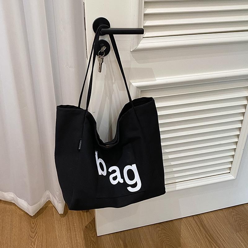 Letter printed canvas tote bag literary fan large capacity students commute to class new fashion shoulder bag чорний
Letter printed canvas tote bag literary fan large capacity students commute to class new fashion shoulder bag чорний