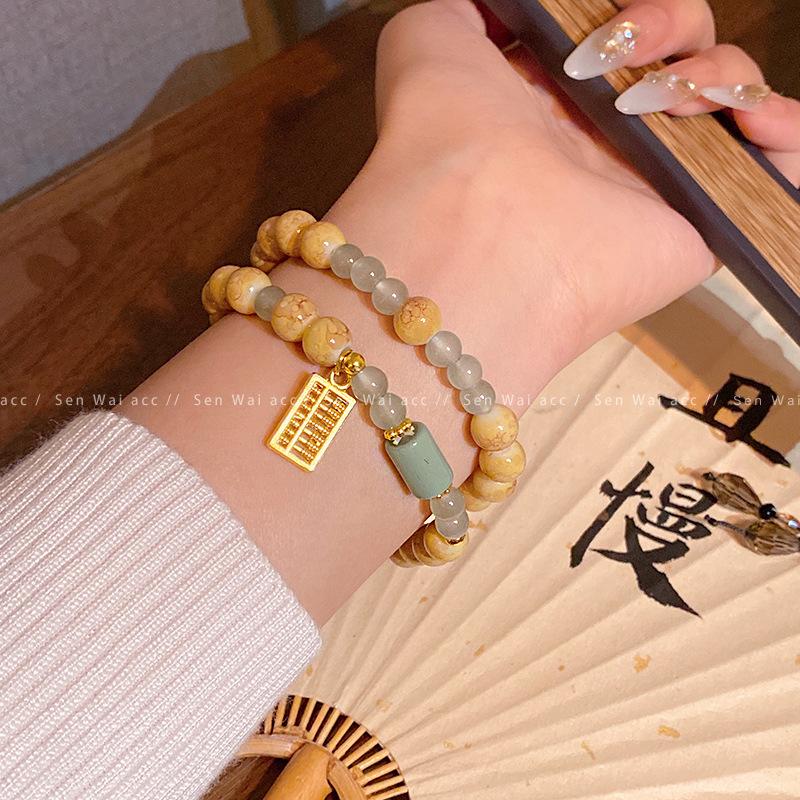 Retro double-layer natural stone beaded bracelet women s new Chinese niche golden abacus bracelet hand jewelry
Retro double-layer natural stone beaded bracelet women s new Chinese niche golden abacus bracelet hand jewelry