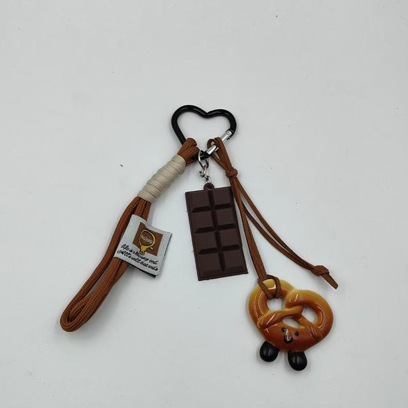 Miu Style Faux Alkaline Water Knot Chocolate Bread Keyring Pendant 01
Miu Style Faux Alkaline Water Knot Chocolate Bread Keyring Pendant 01