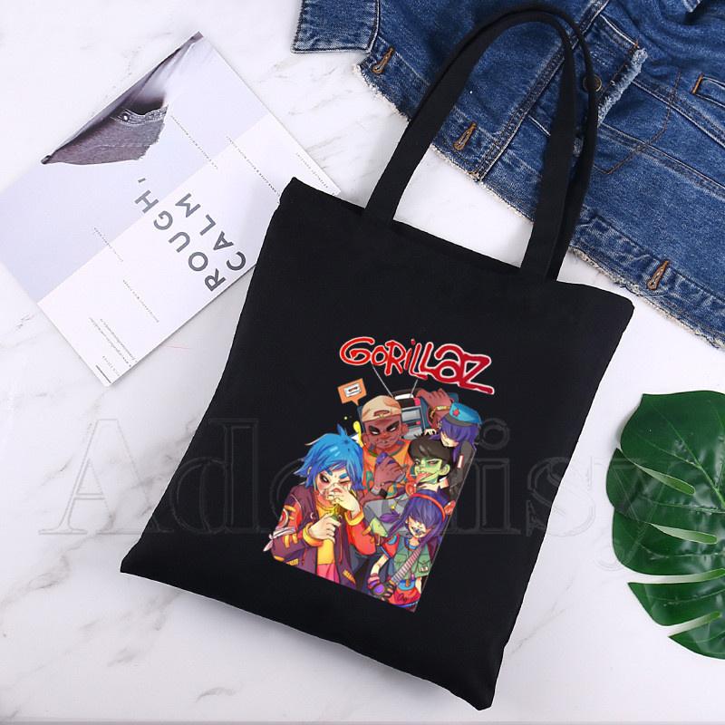 Gorillaz Холщовая сумка Повседневные большие сумки для женщин Дамы Для покупок Сумка Печать Сумка большой емкости Черный
Gorillaz Холщовая сумка Повседневные большие сумки для женщин Дамы Для покупок Сумка Печать Сумка большой емкости Черный