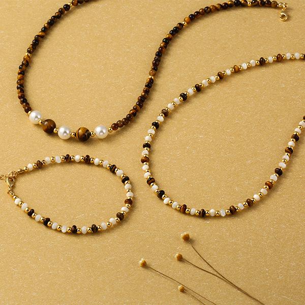 Tiger Eye & Mother-of-Pearl Beaded Choker Necklace for Women - Elegant Clavicle Chain with a Sweet & Cool High-End Style.
Tiger Eye & Mother-of-Pearl Beaded Choker Necklace for Women - Elegant Clavicle Chain with a Sweet & Cool High-End Style.