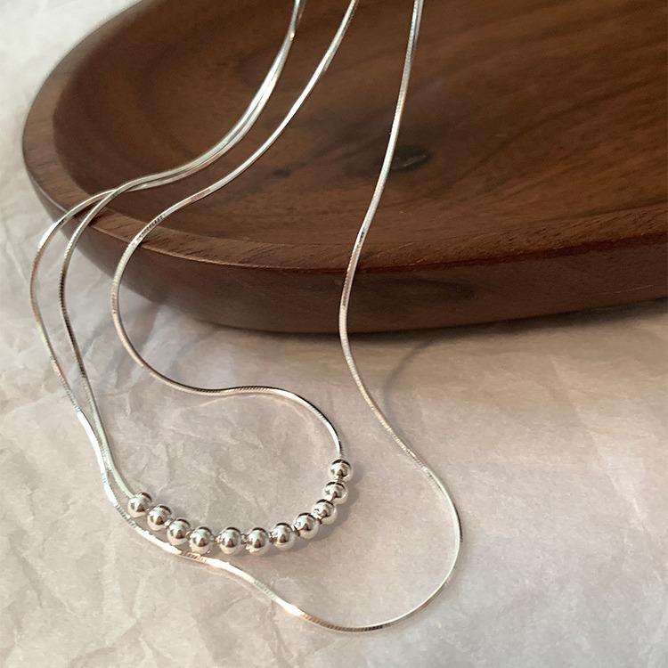 Double-Layer Round Bead Metal Necklace for Women - Fashionable & Versatile Clavicle Chain Design
Double-Layer Round Bead Metal Necklace for Women - Fashionable & Versatile Clavicle Chain Design