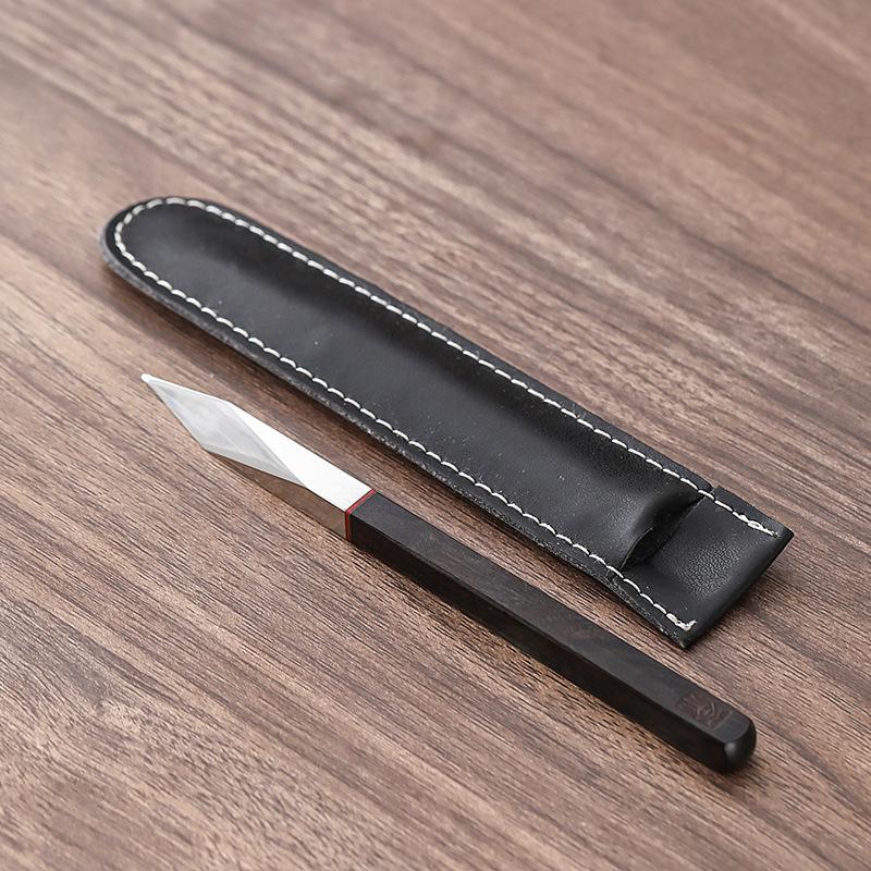 Steel Tea Pick Hand-Forged with Ebony Wood Artisan Tea Knife for Pu-erh Cake Luxury Tea Accessories & Collection Piece
Steel Tea Pick Hand-Forged with Ebony Wood Artisan Tea Knife for Pu-erh Cake Luxury Tea Accessories & Collection Piece