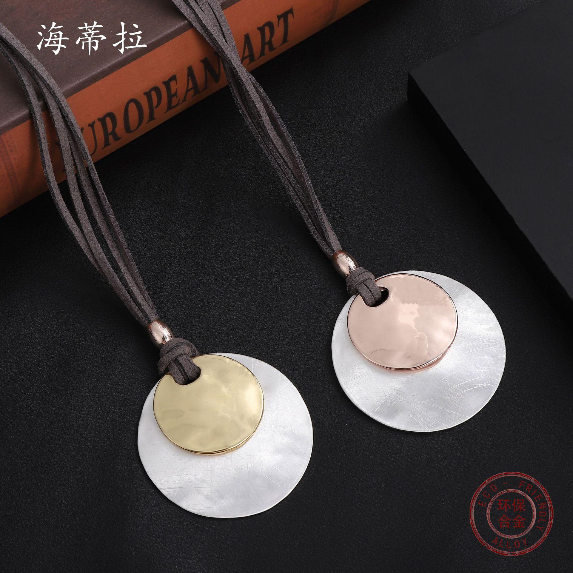 New brushed round alloy pendant, large and small discs stacked with women s premium leather rope sweater chain.
New brushed round alloy pendant, large and small discs stacked with women s premium leather rope sweater chain.