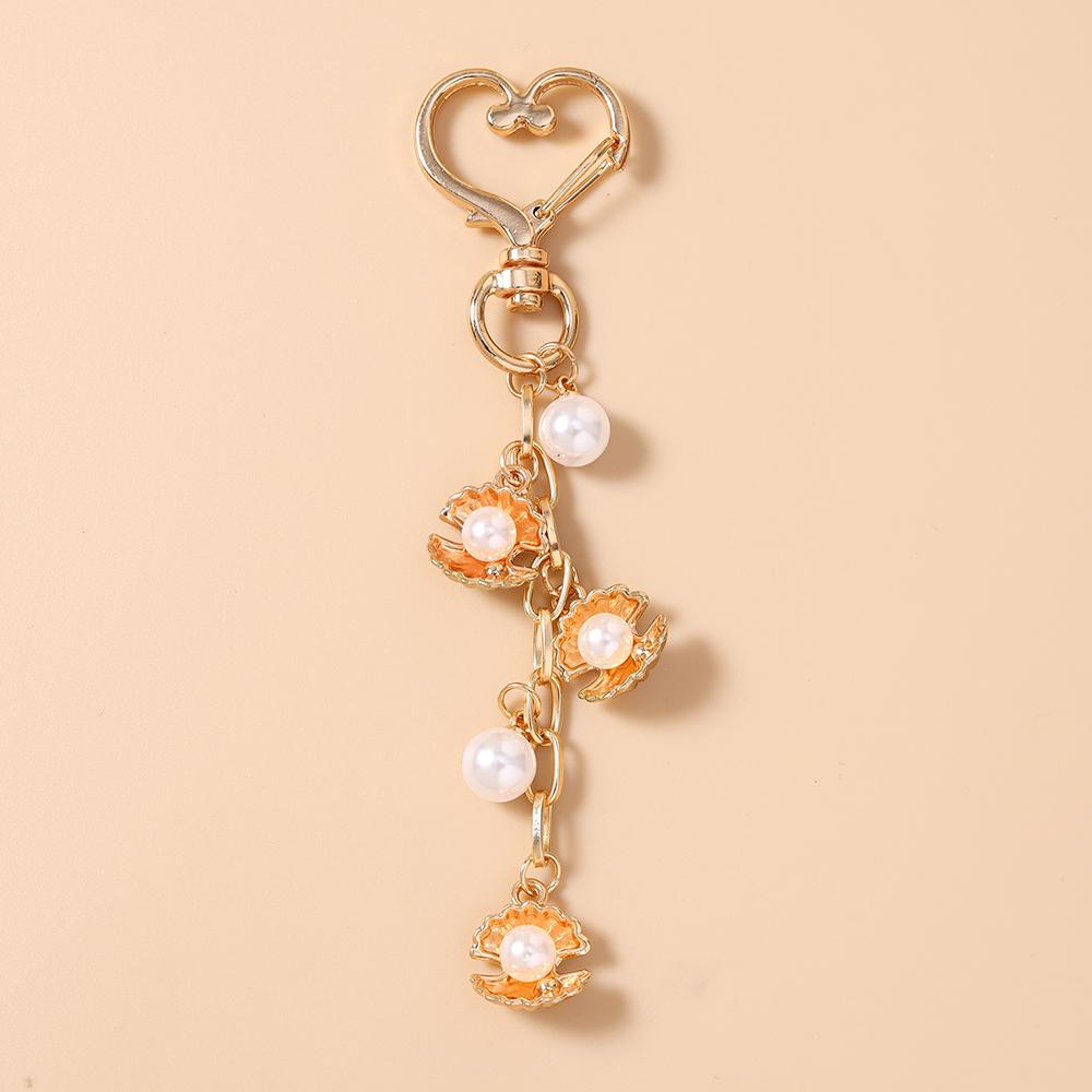 Fashion Summer Beach Shell Keychain Pearl Beaded Key Ring Pendants for Women Girls Handbag Decor DIY Key Chain Jewelry Gifts
Fashion Summer Beach Shell Keychain Pearl Beaded Key Ring Pendants for Women Girls Handbag Decor DIY Key Chain Jewelry Gifts