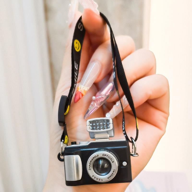 Mini Smiling Doll Camera Pendant with Luminous Ribbon and Plush Individual OPP Packaging
Mini Smiling Doll Camera Pendant with Luminous Ribbon and Plush Individual OPP Packaging