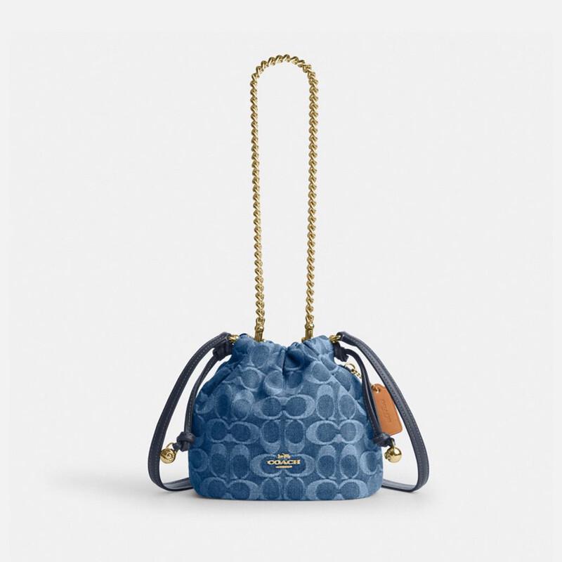 COACH Faye Classic Signature Denim Mini Drawstring Bag
COACH Faye Classic Signature Denim Mini Drawstring Bag