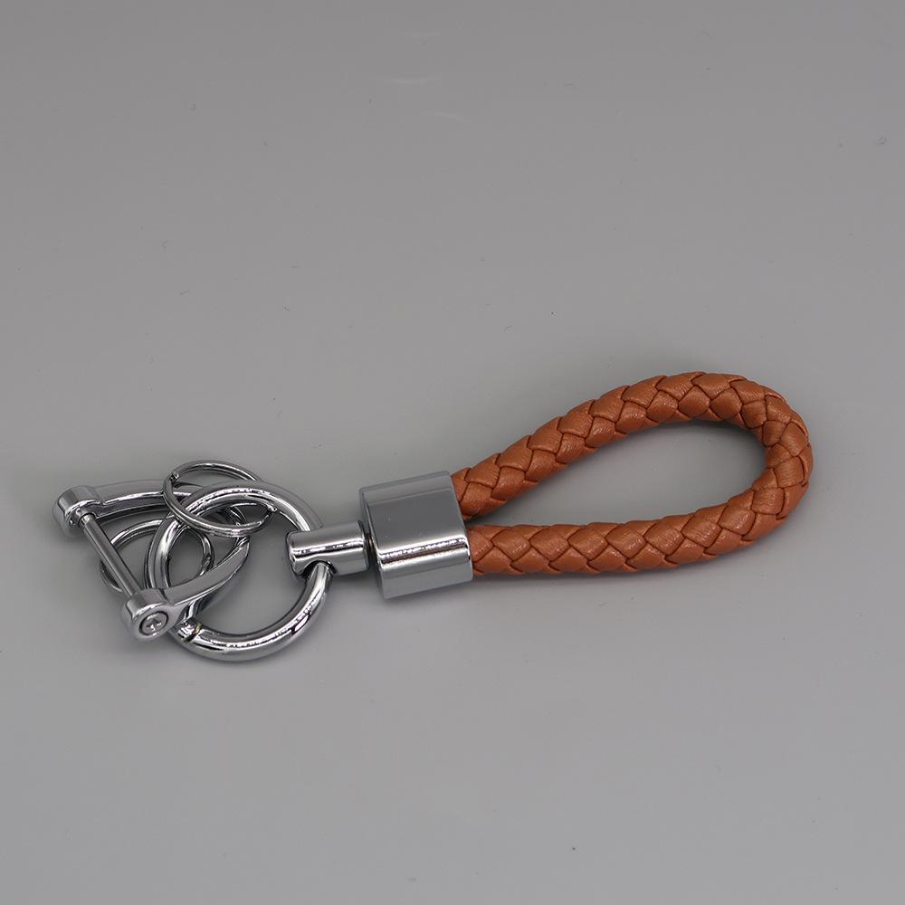 Французский плетеный кожаный брелок для ключей с креативным вращающимся коротким брелоком из цинкового сплава
Французский плетеный кожаный брелок для ключей с креативным вращающимся коротким брелоком из цинкового сплава