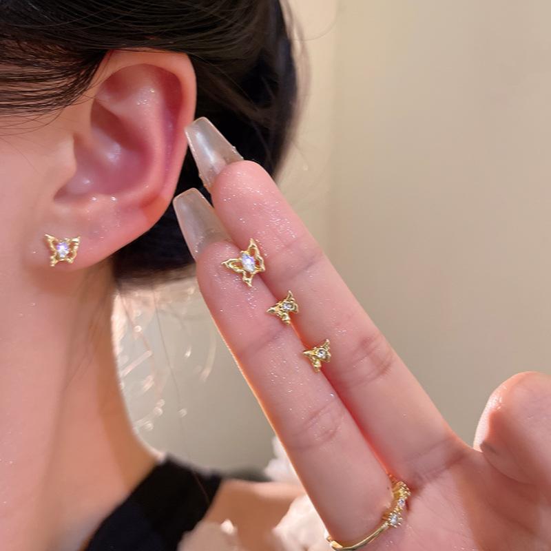 Four-piece set of gold three-dimensional hollow butterfly stud earrings for women s design set, earrings and ears.
Four-piece set of gold three-dimensional hollow butterfly stud earrings for women s design set, earrings and ears.