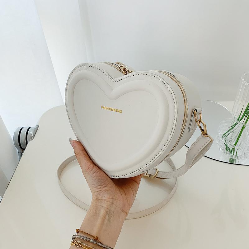 Fashion Heart Shaped Candy Color Small Shoulde Sling Bag For Girl PU Leather Zipper Women Casual Crossbody Bag 20x15x7cm
Fashion Heart Shaped Candy Color Small Shoulde Sling Bag For Girl PU Leather Zipper Women Casual Crossbody Bag 20x15x7cm
