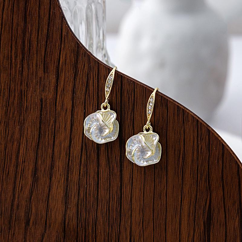 Elegant French Camellia Earrings: Luxurious Flower Dangle with Micro-Paved Design
Elegant French Camellia Earrings: Luxurious Flower Dangle with Micro-Paved Design