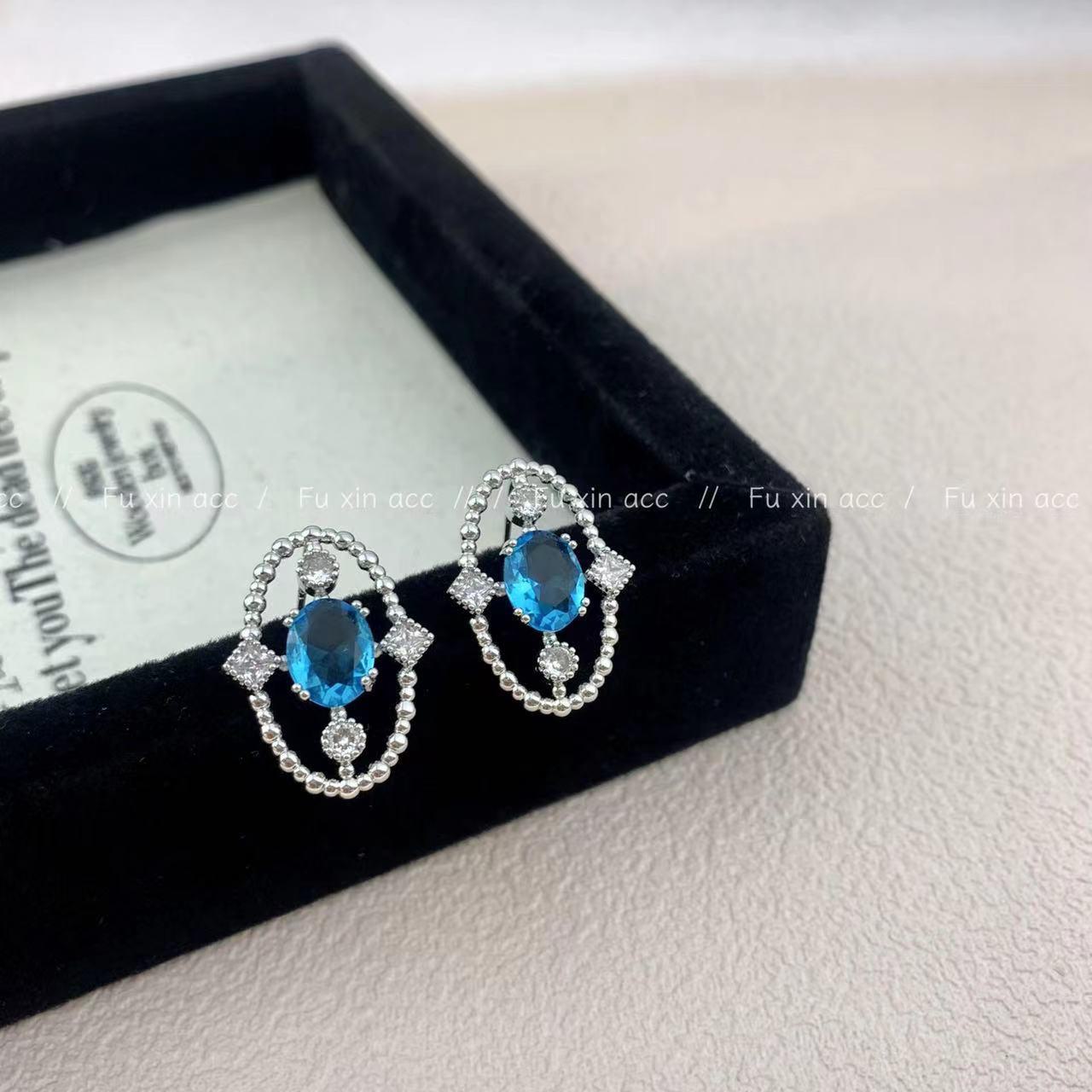 Изысканные овальные серьги с топазами и сапфирами — шикарные и универсальные украшения для женщин
Изысканные овальные серьги с топазами и сапфирами — шикарные и универсальные украшения для женщин