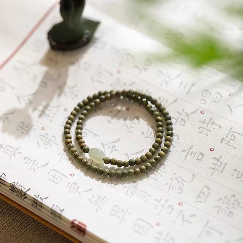 4mm Green Sandalwood & Hetian Jade Bead Bracelet - Ancient & Refined Buddhist Style for Women
4mm Green Sandalwood & Hetian Jade Bead Bracelet - Ancient & Refined Buddhist Style for Women