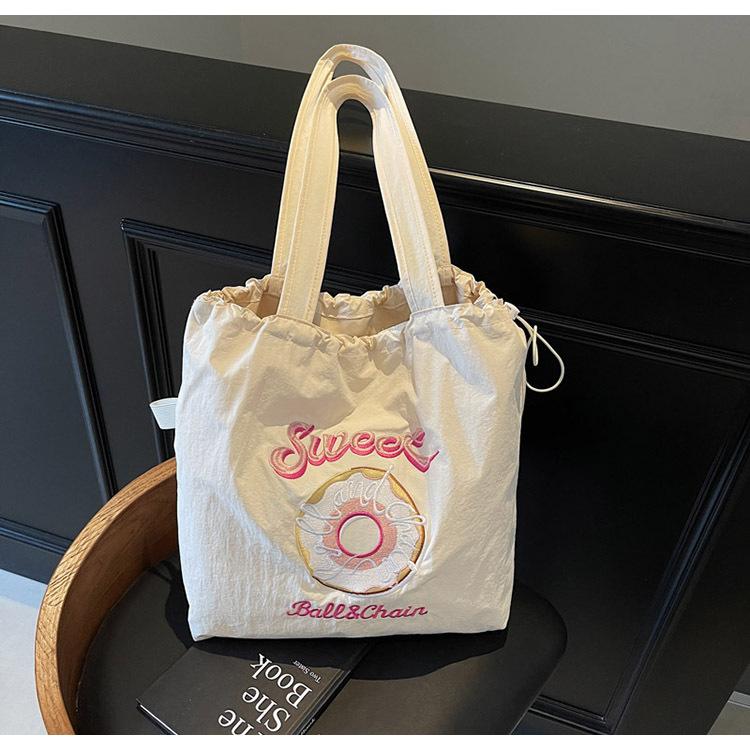 Embroidery donut nylon bag women s new fashion cartoon commuter bag shoulder handbag
Embroidery donut nylon bag women s new fashion cartoon commuter bag shoulder handbag