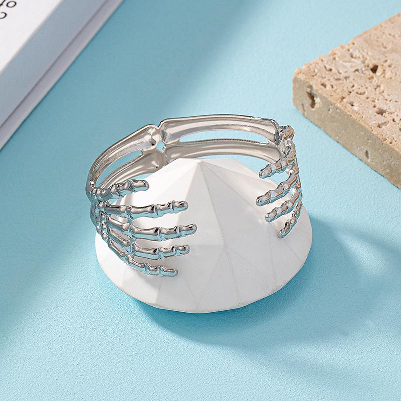 Готический браслет из черного никеля с регулируемым дизайном золотого когтя руки скелета
Готический браслет из черного никеля с регулируемым дизайном золотого когтя руки скелета