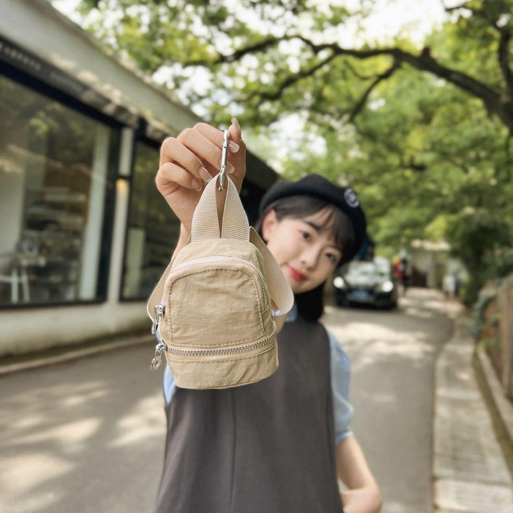 Однотонный нейлоновый мини-рюкзак, мини-сумочка, сумка для карт, милый маленький кошелек, сумка для ключей розовый
Однотонный нейлоновый мини-рюкзак, мини-сумочка, сумка для карт, милый маленький кошелек, сумка для ключей розовый