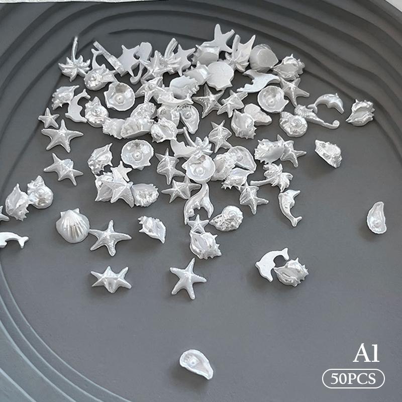 50 шт. Микс Серия Океан Жемчужная Ракушка Морская Звезда Ювелирные Изделия Флэш Украшения для Ногтей Аксессуары для Ногтей Подвески Материалы
50 шт. Микс Серия Океан Жемчужная Ракушка Морская Звезда Ювелирные Изделия Флэш Украшения для Ногтей Аксессуары для Ногтей Подвески Материалы