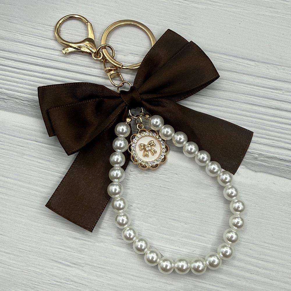 Handcrafted Faux Pearl Bow Keychain Pendant
Handcrafted Faux Pearl Bow Keychain Pendant