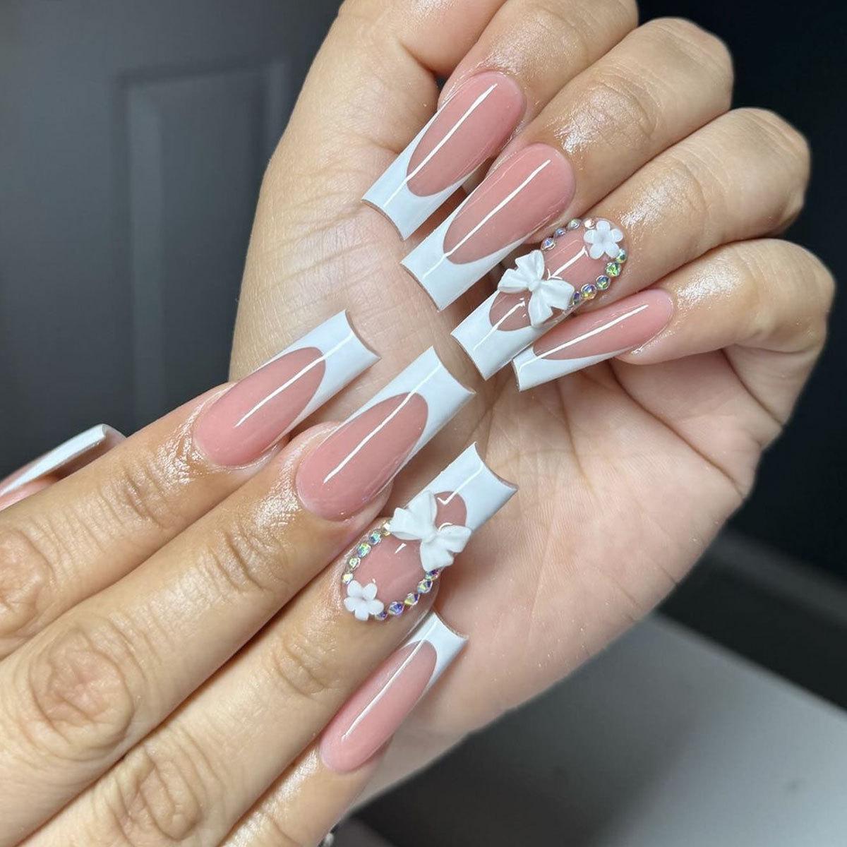 European Long Coffin White French Tip Press-On Nails with 3D Bow, Five-Petal Flower, and Rhinestone.
European Long Coffin White French Tip Press-On Nails with 3D Bow, Five-Petal Flower, and Rhinestone.