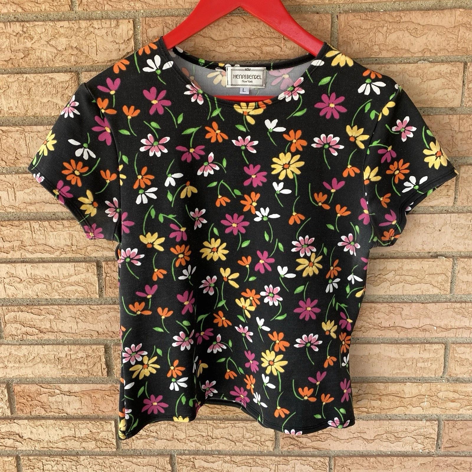 90s HENRI BENDEL black floral print stretch knit t-shirt tag L fits S/M retro L
90s HENRI BENDEL black floral print stretch knit t-shirt tag L fits S/M retro L
