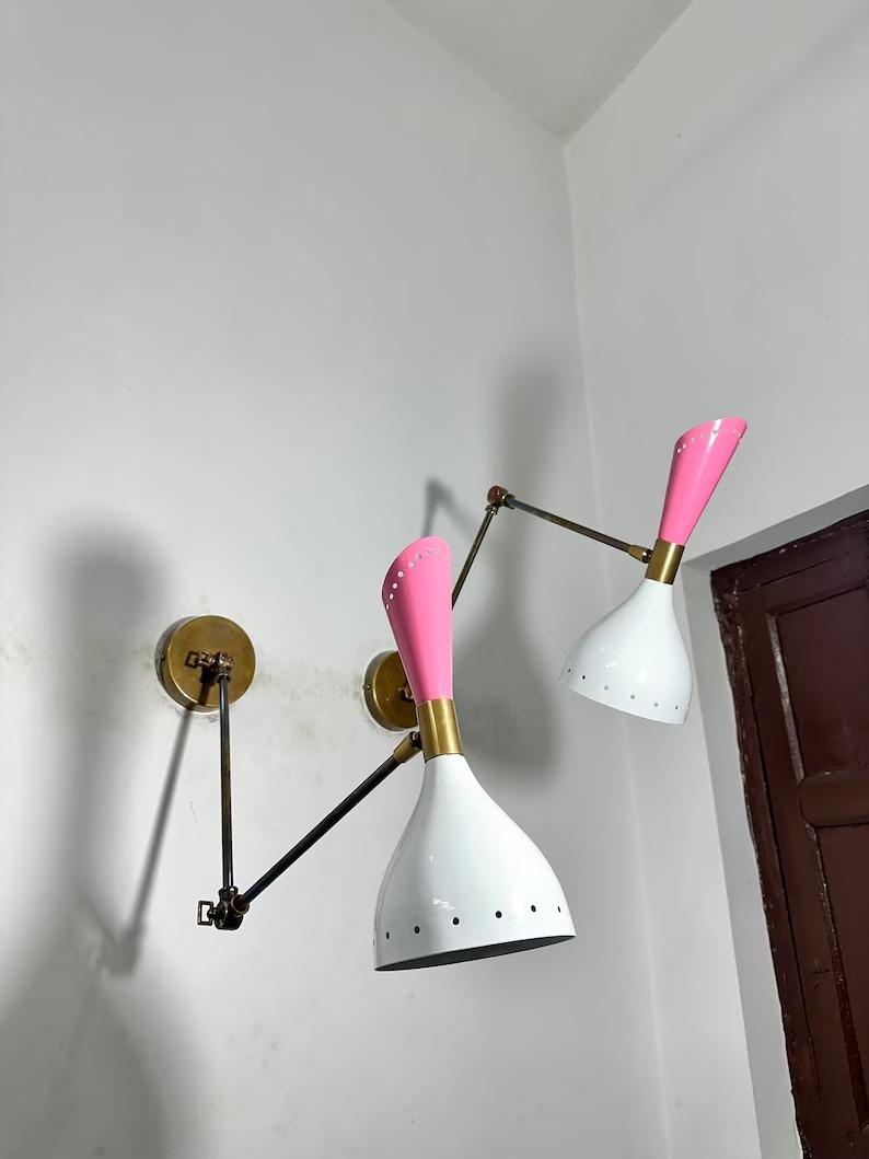 Mid Century Brass Diabolo Wall Sconce: Adjustable Reading Lamp
Mid Century Brass Diabolo Wall Sconce: Adjustable Reading Lamp