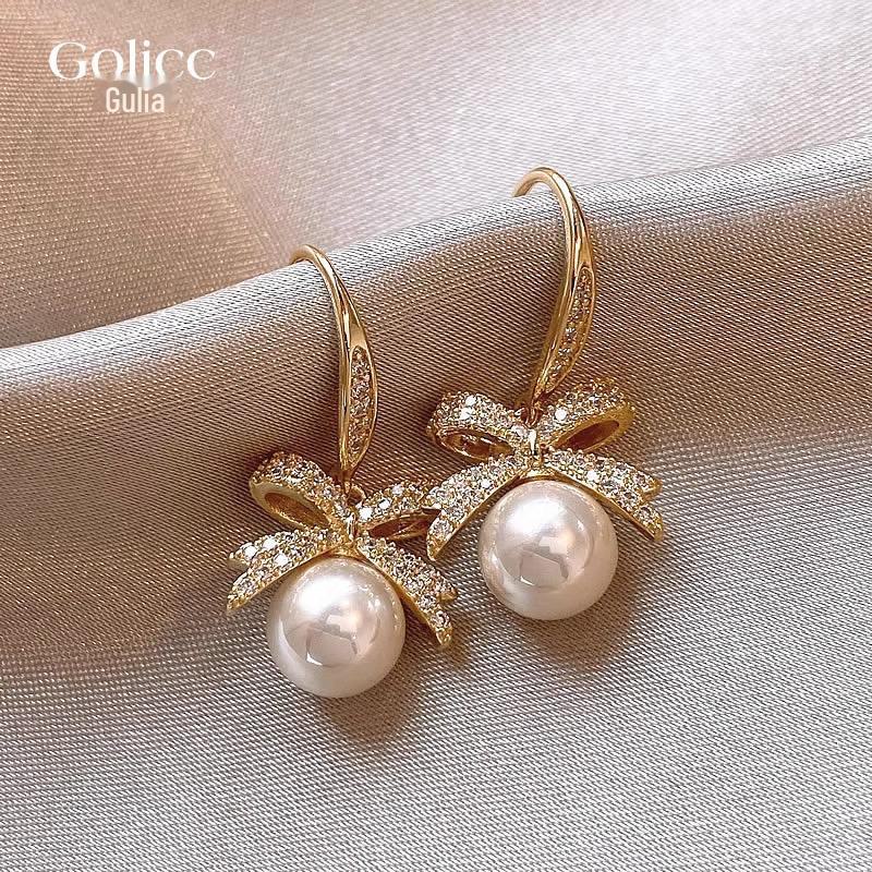 Серьги-крючки Guliya Bow Pearl: Роскошные, модные серьги 2023 года для женщин высокого класса белый/золотой
Серьги-крючки Guliya Bow Pearl: Роскошные, модные серьги 2023 года для женщин высокого класса белый/золотой