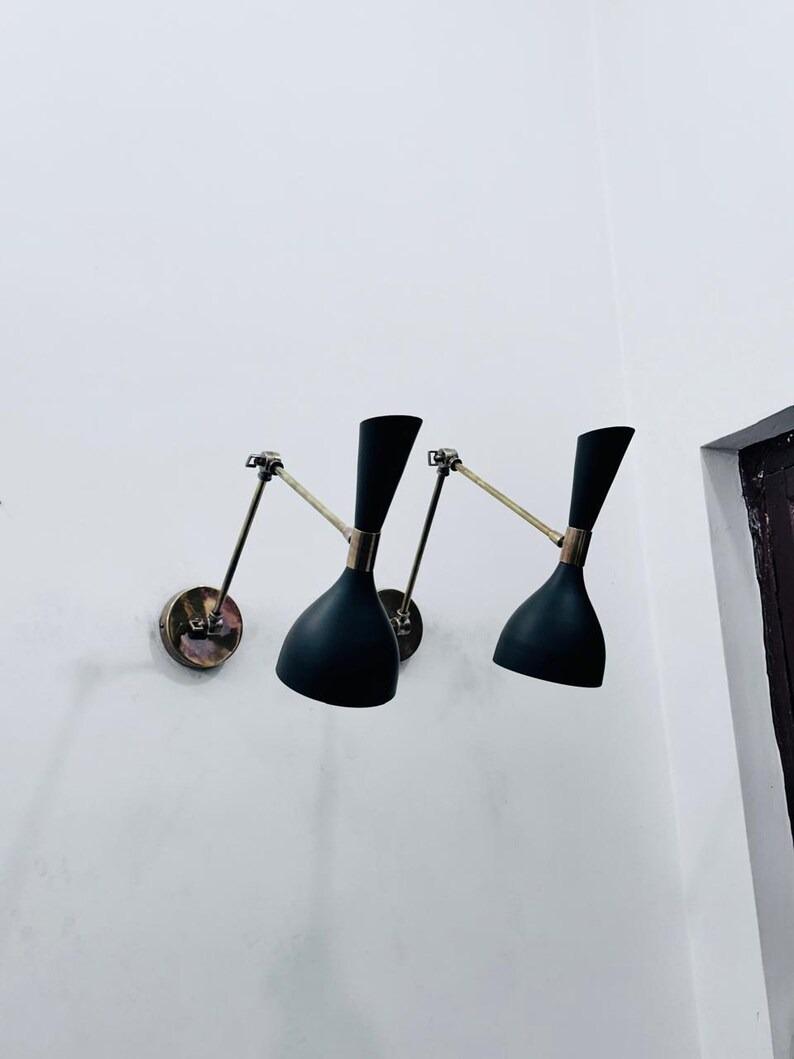 Пара італійських бра з латуні середини століття: Регульоване освітлення Stilnovo чорний
Пара італійських бра з латуні середини століття: Регульоване освітлення Stilnovo чорний