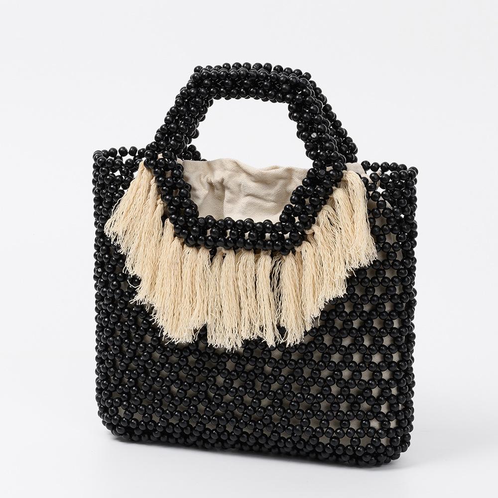 Summer Large Capacity Tassel Handbag Handwoven Hollow Out Women Beach Holiday Wood Beaded Tote Ethnic Style Netted Canvas Clutch 28x5x24cm
Summer Large Capacity Tassel Handbag Handwoven Hollow Out Women Beach Holiday Wood Beaded Tote Ethnic Style Netted Canvas Clutch 28x5x24cm