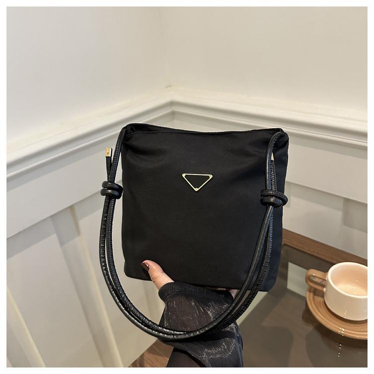 And Black Trendy White Bucket Bag With Unique Texture And Design Modern StyleC
And Black Trendy White Bucket Bag With Unique Texture And Design Modern StyleC